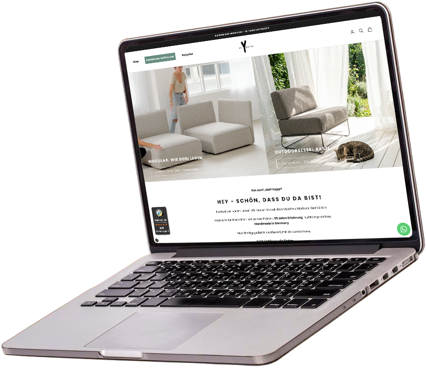 schwebend animierter Laptop, welcher eine individuelles Shopify Webshop Design für ein Interior E-Commerce Unternehmen zeigt